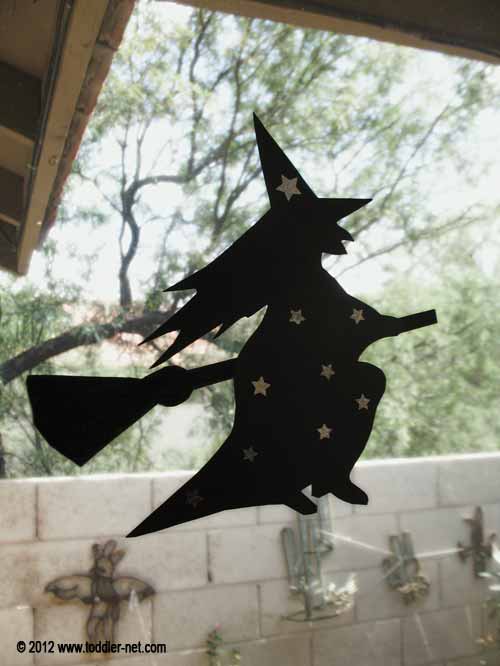 witch figure on the window